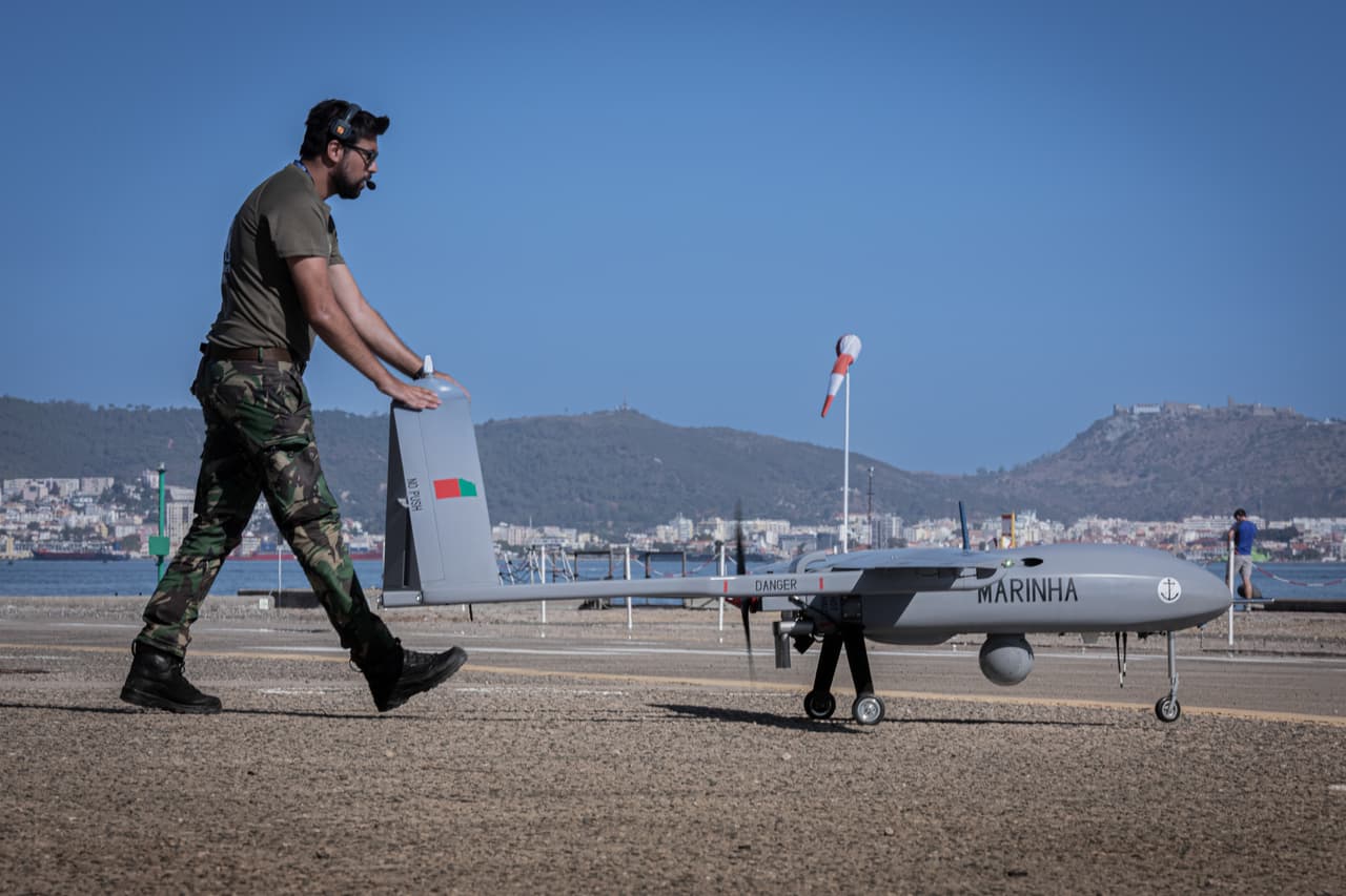 A Portuguese official demonstrating a UAV at REPMUS 2025. 