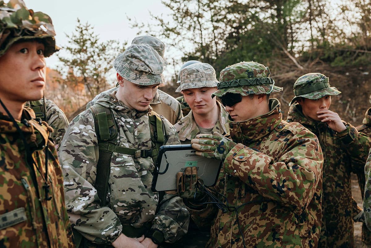 Japanese Ground Self Defence Forces’ showcase their drones view on a tablet to British troops