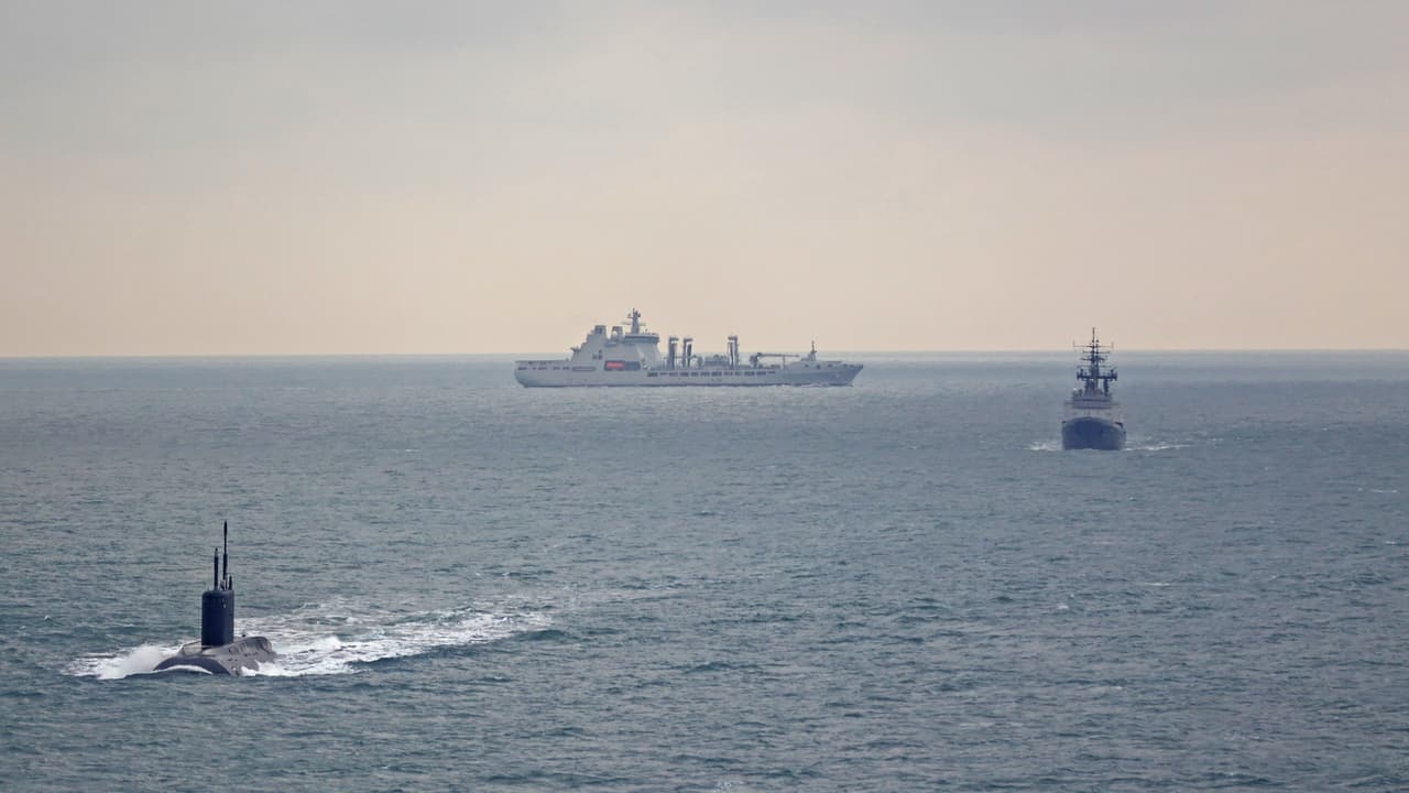 UK assets watch a Russian submarine and its surface escorts in waters around the UK in 2025.