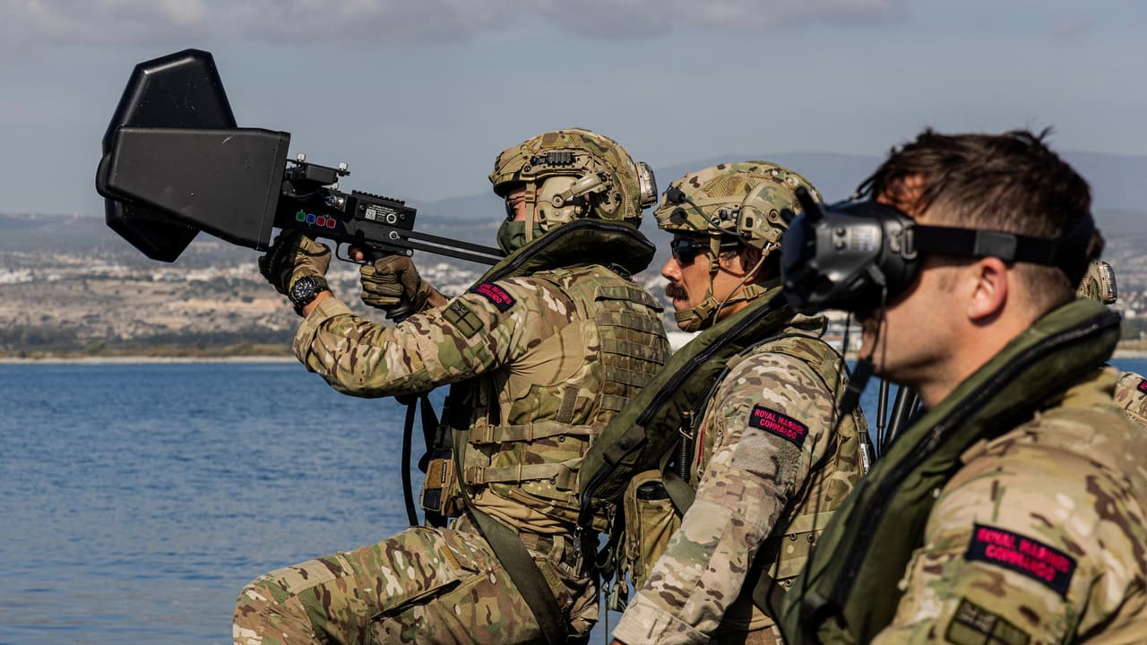 Royal Marines using the Kirintec Recurve C-UAS system on board a Commando Raiding Craft. 