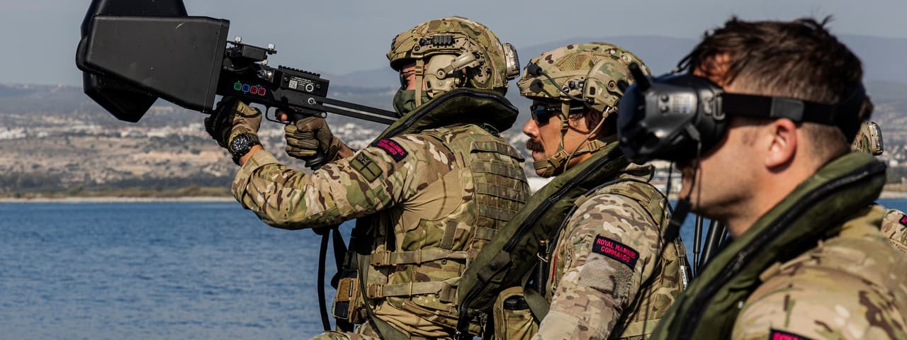Royal Marines using the Kirintec Recurve C-UAS system on board a Commando Raiding Craft. 
