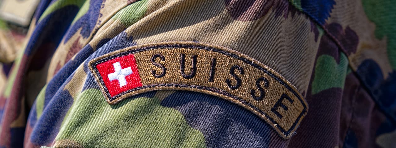 A shoulder patch on the sleeve of a member the Swiss Armed Forces.