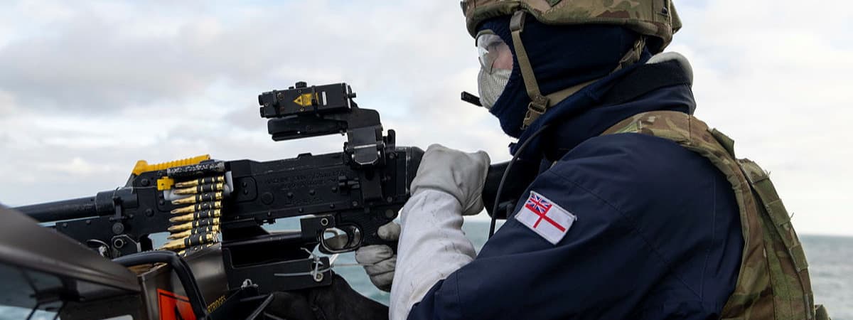 A Royal Navy sailor shooting down a drone during Exercise Sharpshooter - a Royal Navy exercise tasked with fending off attacks from autonomous threats. 