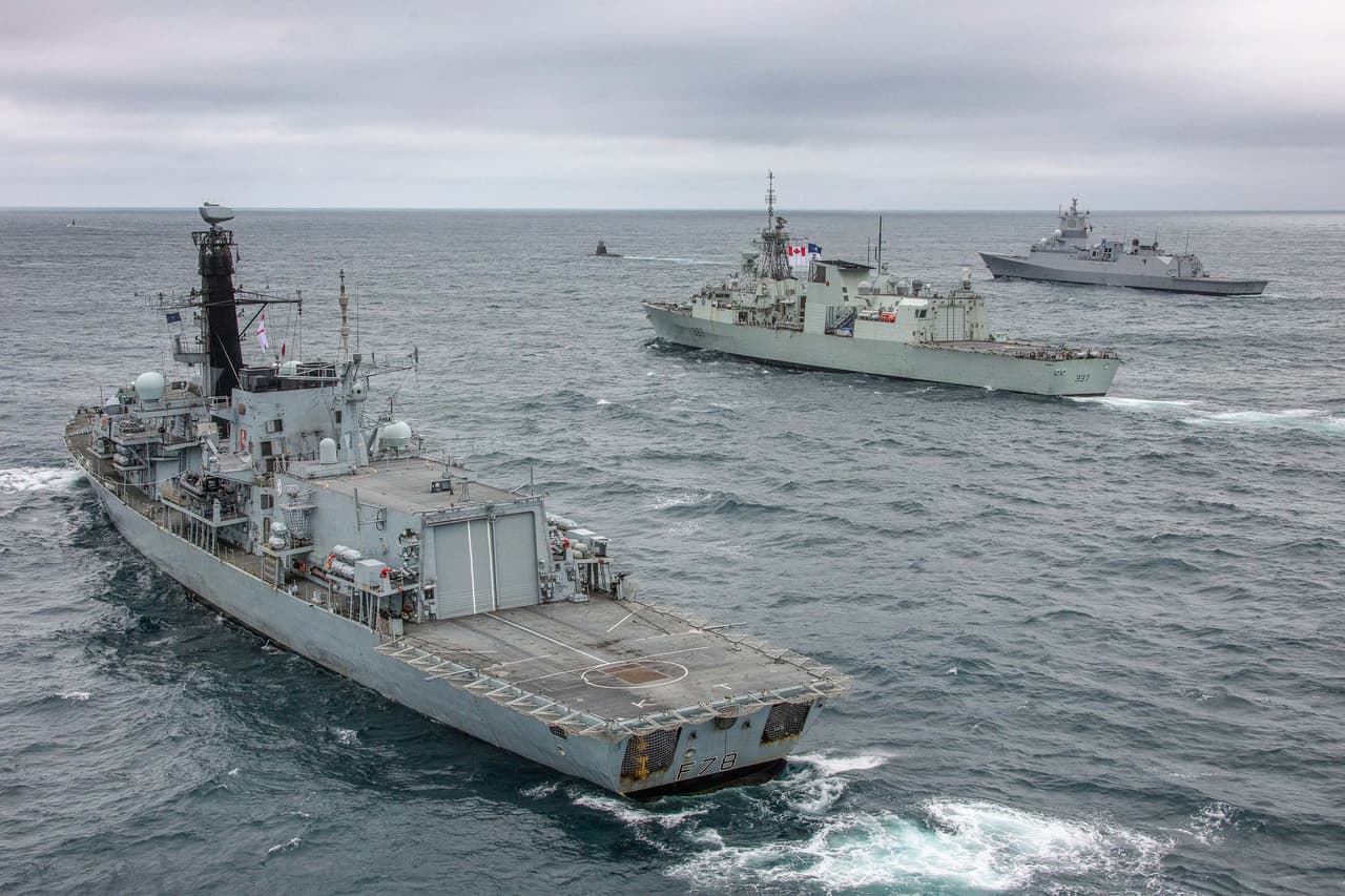 NATO naval ships and submarines, including the RN Type 23 ASW frigate HMS Kent (left), sail in NATO’s North Atlantic ASW exercise ‘Dynamic Mongoose’ in 2020. 